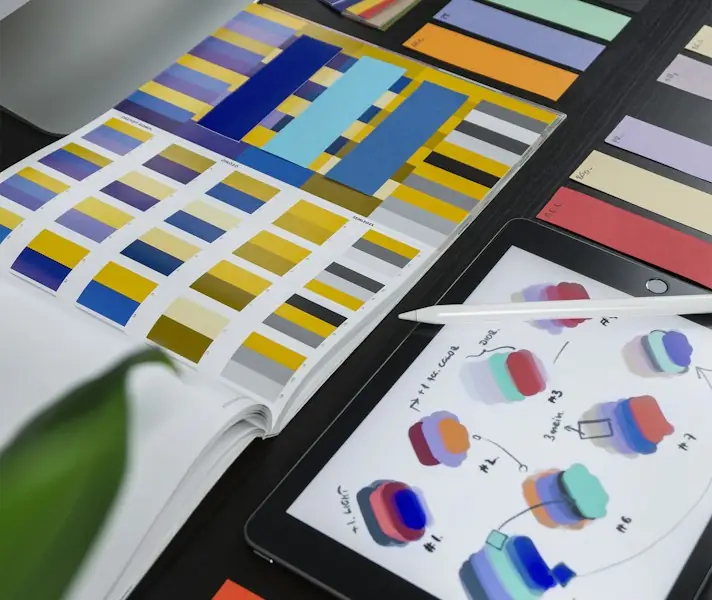 Colour swatches and design samples spread across a desk